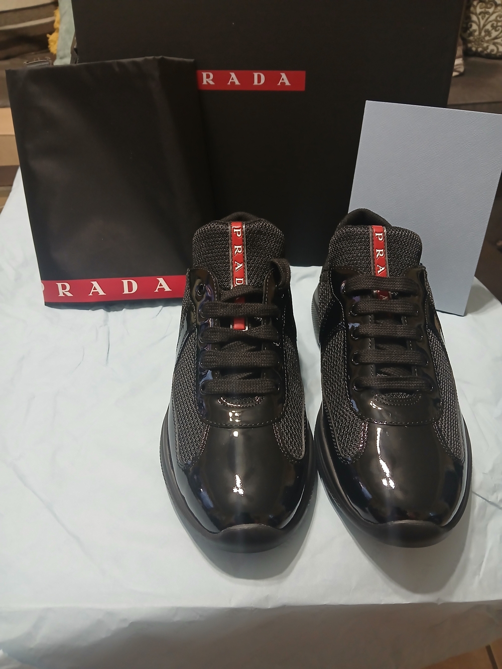 Prada Black Patent & Mesh Low-Top Sneakers with Red Logo Tongue